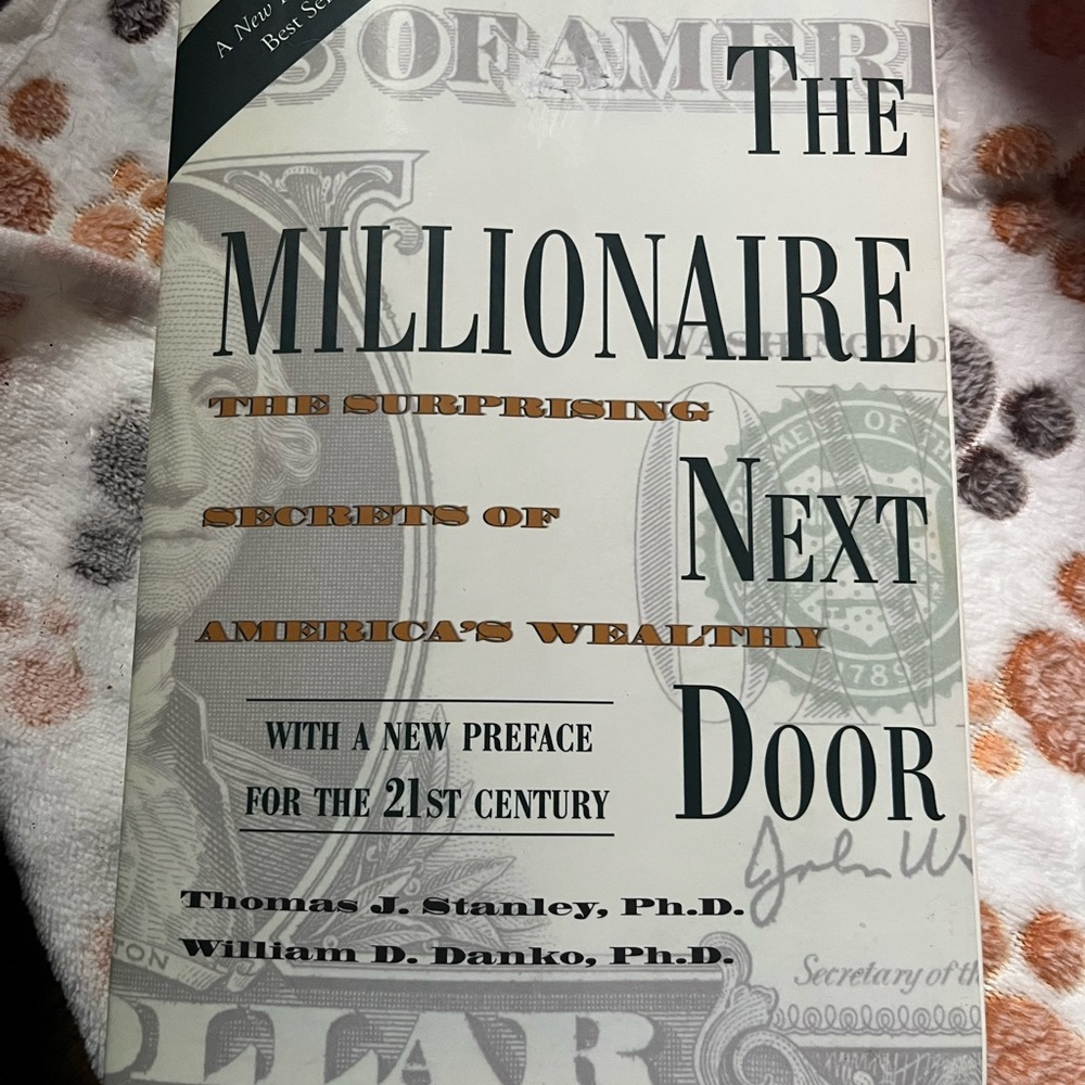 National Book Network - The Millionaire Next Door in Black, Gray, and Orange